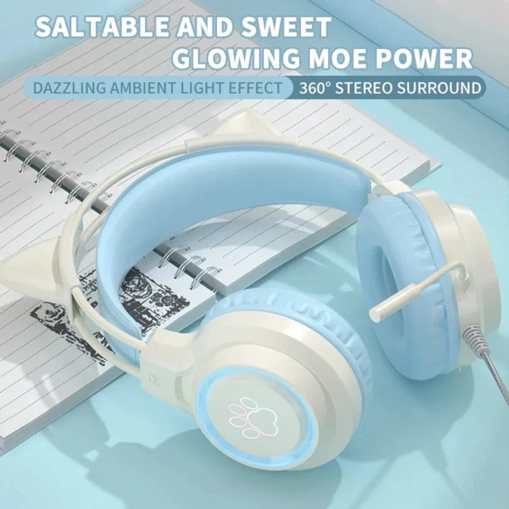 Light blue headphones with glowing accents on a notebook background