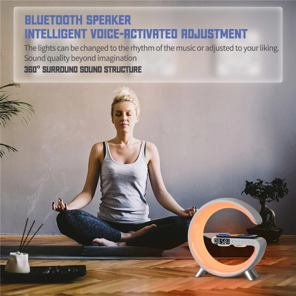 Woman meditating with a Bluetooth speaker in a room setting