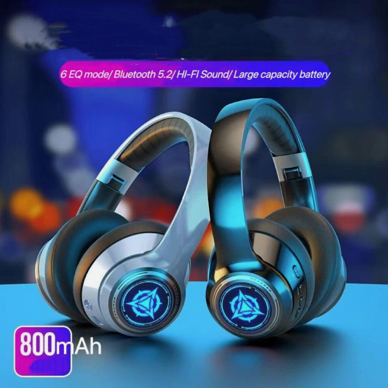 Pair of futuristic headphones with glowing elements on a blurred cityscape background