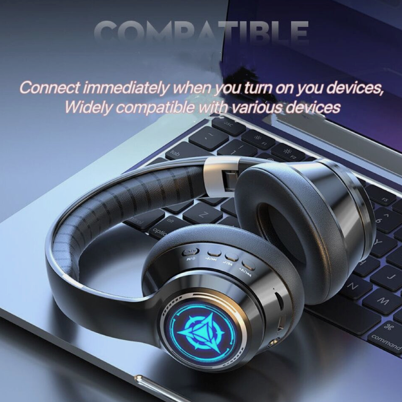 Headphones with a blue light on a laptop keyboard, text about compatibility.